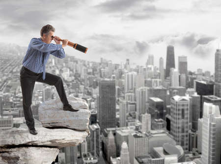Business concept.  Business man looks through a telescope