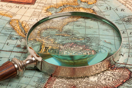 Magnifying glass and ancient old mapの写真素材