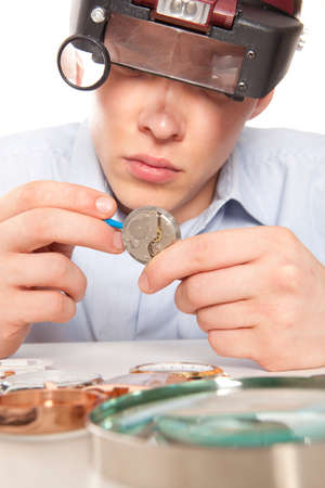 Watchmaker. Watch repair craftsman repairing watchの写真素材