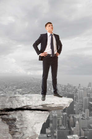 Businessman standing on a peak  Business conceptの写真素材