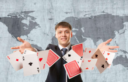 Bluff, Businessman playing with poker cardsの写真素材
