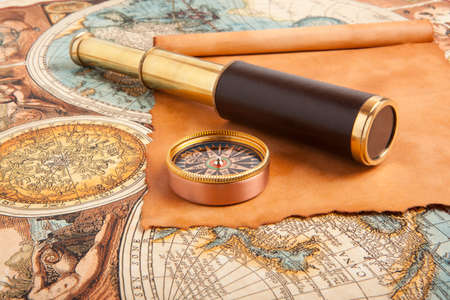 Vintage brass telescope on old antique mapの写真素材
