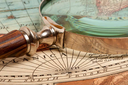 Magnifying glass and ancient old mapの写真素材