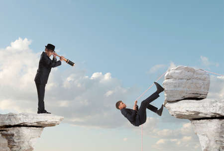 Businessman looks through a telescope. Concept for businessの写真素材