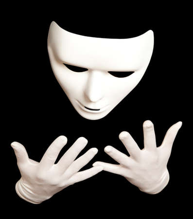 White theatrical mask isolated on blackの写真素材