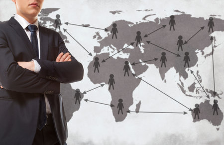 Globalization. Young business man with world mapの写真素材