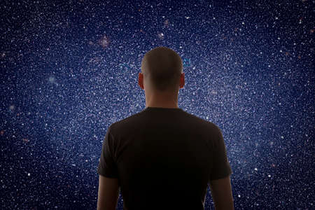 Universe. Starry sky and silhouette of manの写真素材