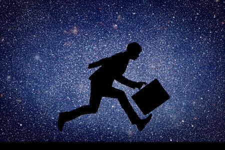 Businessman running with a briefcase against the background of starry sky