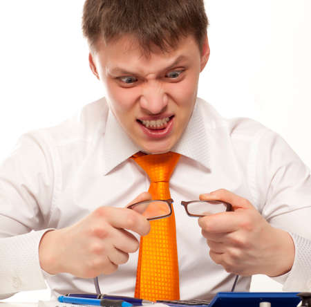 Businessman broke glasses isolated on whiteの写真素材