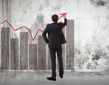 Businessman drawing increasing graph.  Business conceptの写真素材