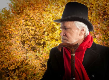 Autumn. Portrait of a senior man thinking about somethingの写真素材