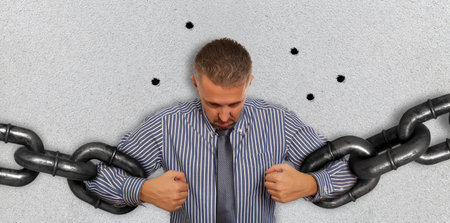 Businessman with several sections of huge chain
