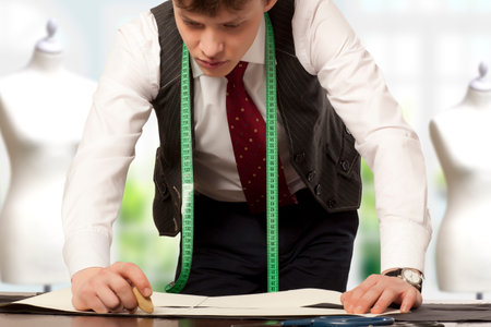 Young male tailor working in a workshop