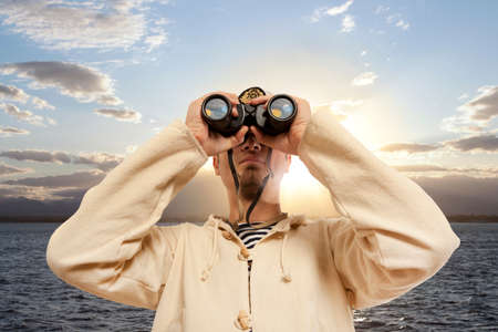 Captain looks through a binoculars. Marine conceptの写真素材