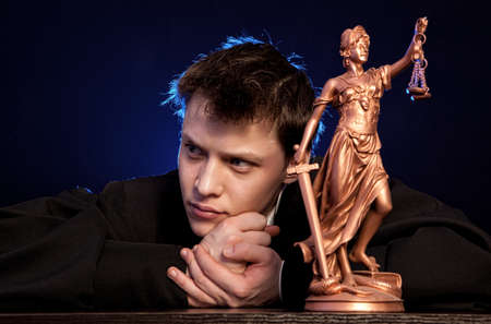 Judge. Male judge in a courtroom striking the gavelの写真素材