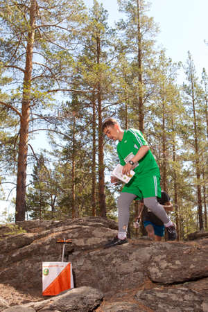 RUSSIA, ULAN-UDE - MAY 22, 2016: Russian Azimut - 2016. Orienteering competition is held annually in the Buryatia region. People at at control point at orienteering course.のeditorial素材