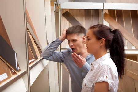 Couple shopping parquet in hardware store, shop for constructionの写真素材