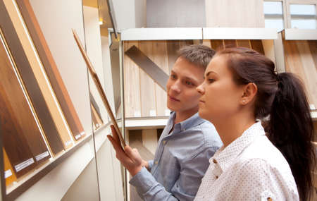 Couple shopping parquet in hardware store, shop for constructionの写真素材