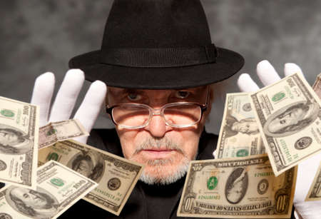 Magician show with playing cards. On grey backgroundの写真素材