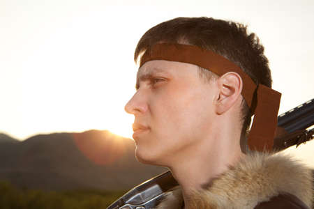 Hunter in vintage clothes ready to hunt with hunting rifleの写真素材