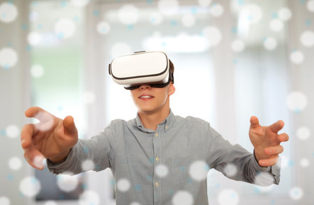 Young man wearing virtual reality glasses