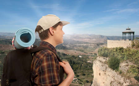 Young man with a travel backpackの写真素材
