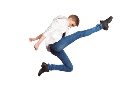 Young casual woman jumping. Isolated on white
