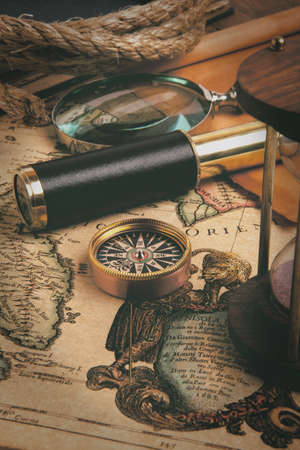 Vintage brass telescope on old antique mapの写真素材