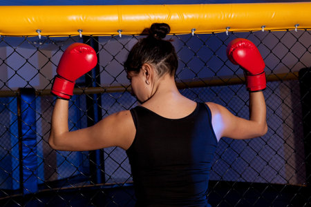 Portrait of woman training gym boxing mma ring