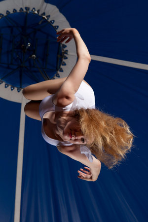 Circus air gymnast on dark blue backgroundの写真素材