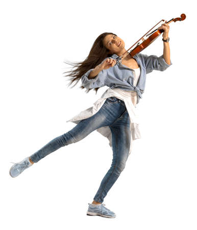 Playing the violin. Young woman playing violin on white isolated background の写真素材