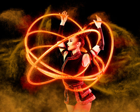 Elegance woman juggler carries out show with hoops