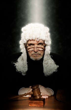 Judge. Male judge in a courtroom striking the gavelの写真素材