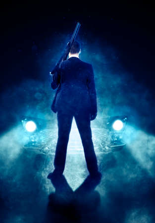Businessman gangster shooting with gun. Design for coverの写真素材