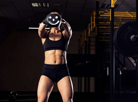 Strong woman doing her kettlebell exerciseの写真素材