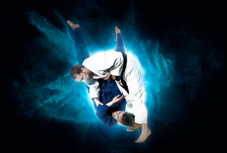 Battle of two fighters judo sports judo competitionsの写真素材