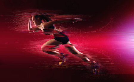 Woman sprinter leaving starting. Exploding start