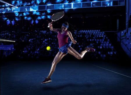 Female tennis player in action during gameの写真素材
