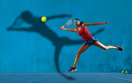 Female tennis player in action during gameの写真素材