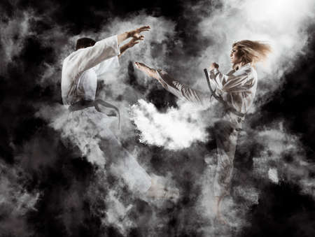 Martial arts masters, karate practice. Smoke backgroundの写真素材