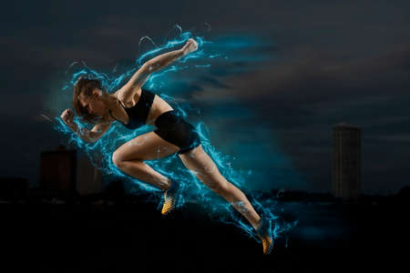 Woman sprinter leaving starting. Exploding startの写真素材