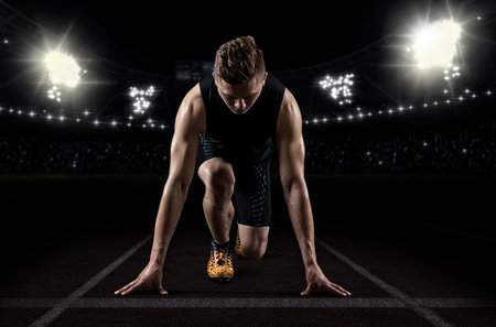 Man sprinter leaving starting. Exploding start
