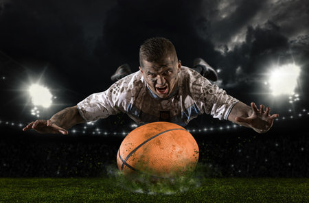 Rugby player in action on stadium backgroundの写真素材