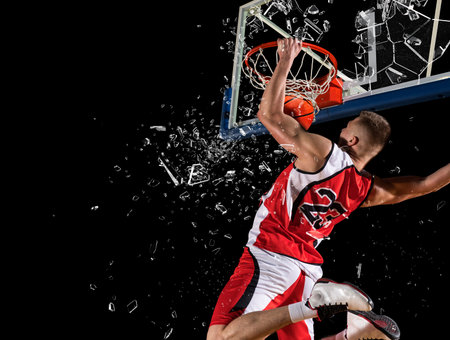 Shattered backboard. Basketball player players in action. Basketball concept on dark background