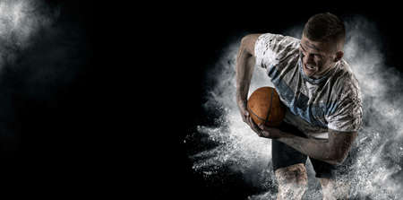 Man rugby player holds ball. Sports banner. Horizontal copy space backgroundの写真素材