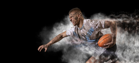 Handsome rugby player in action on dark smoke backgroundの写真素材