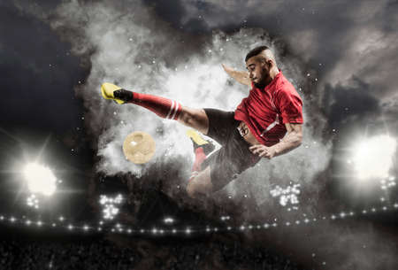 Soccer player in action on smoke background. Sports banner. Copy space backgroundの写真素材