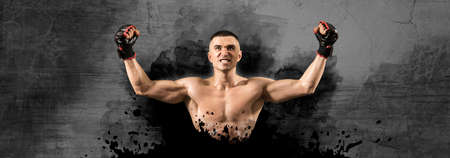MMA fighter celebrating win. Isolated on wall backgroundの写真素材
