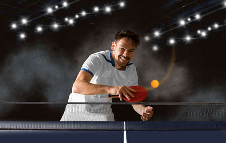 Man playing on dark backgroundの写真素材