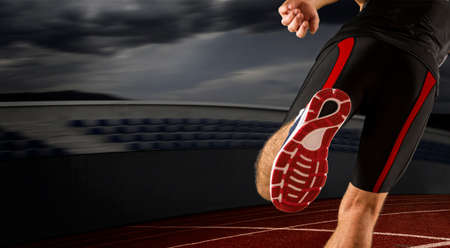 Runner feet running on road close up on shoe. Concept of sport, movement, energy, dynamic, healthy lifestyleの写真素材